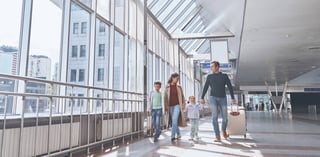 Family transiting through the airport terminal