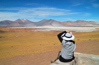 female traveler being impressed of salar de talar salt lakes in atacama desert female traveler being impressed of salar de talar salt lakes in atacama desert