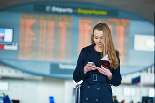 young woman in international airport near the flight young woman in international airport near the flight