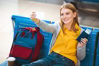 Woman holding passport and phone with QR code about vaccination Woman holding passport and phone with QR code about vaccination