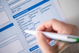 Woman filling employment contract noting