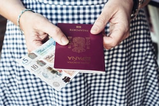 Close Up Of Woman With Passport And Banknotes Close Up Of Woman With Passport And Banknotes