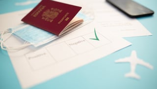 Passport With Certificate Of Immunity Smartphone That Shows Health Declaration Passport With Certificate Of Immunity Smartphone That Shows Health Declaration