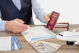 Young Businessman With International Passport And Avia Ticket Filling Young Businessman With International Passport And Avia Ticket Filling