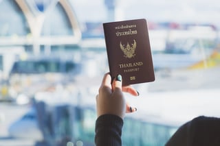 Travel Concept Closeup Of Woman Hand Holding Thai Passport Ready To Boarding Travel Concept Closeup Of Woman Hand Holding Thai Passport Ready To Boarding
