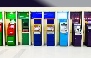 Row of colorful ATM machines indoors Row of colorful ATM machines indoors