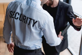 Security officer scanning a passenger Security officer scanning a passenger