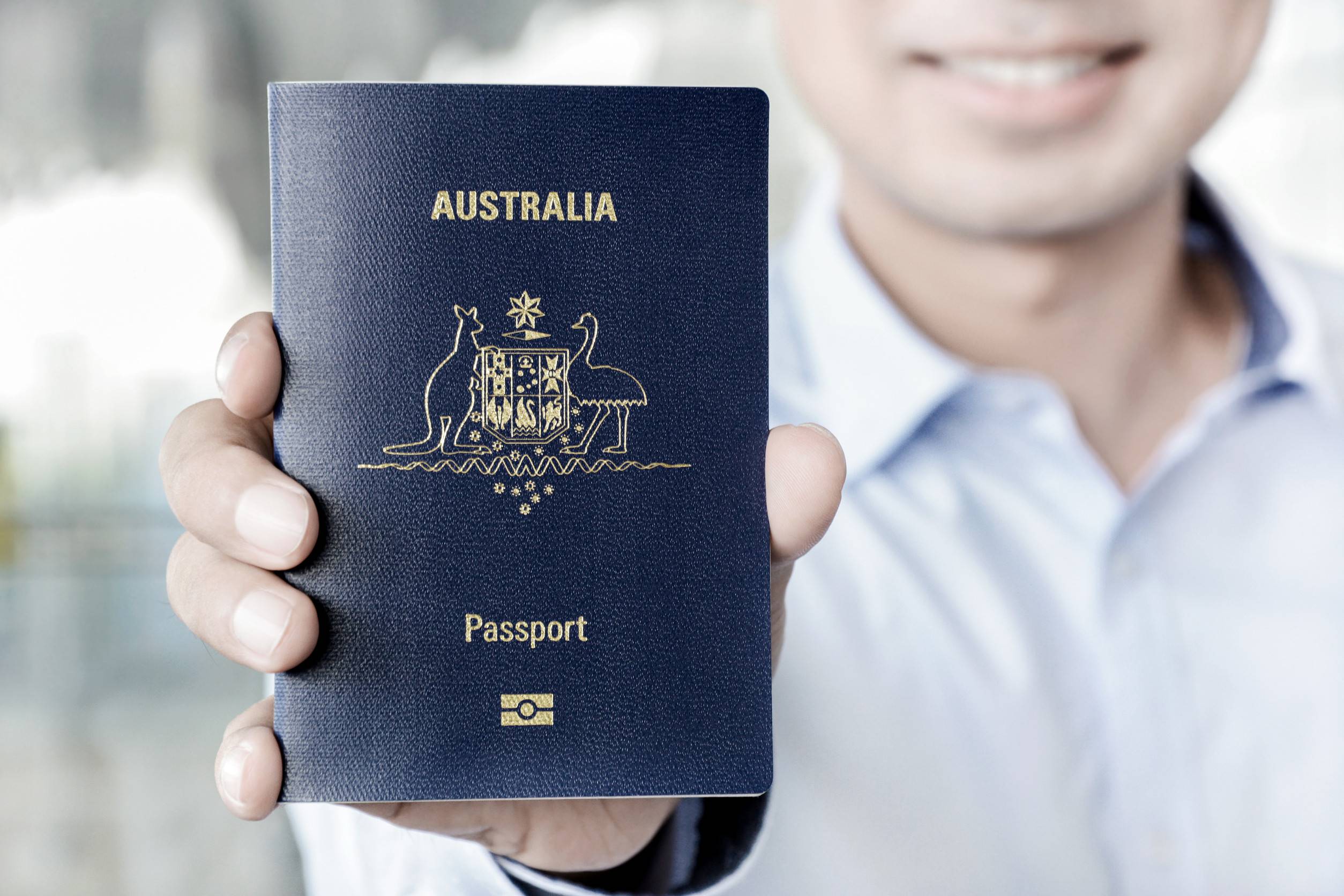 A man showing passport of Australia A man showing passport of Australia