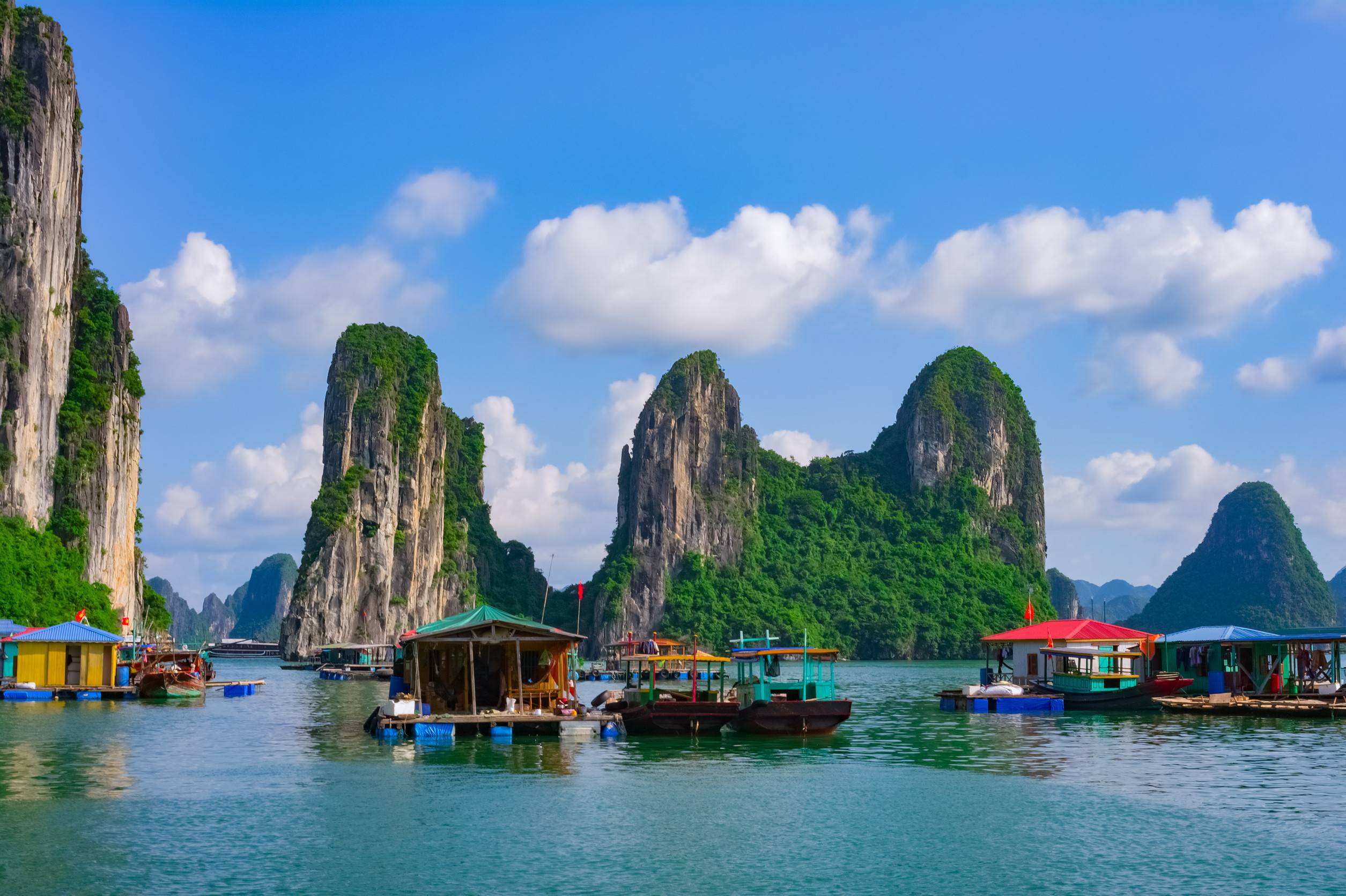 floating village and rock islands in Halong Bay, Vietnam, Southeast Asia, UNESCO World Heritage Site floating village and rock islands in Halong Bay, Vietnam, Southeast Asia, UNESCO World Heritage Site